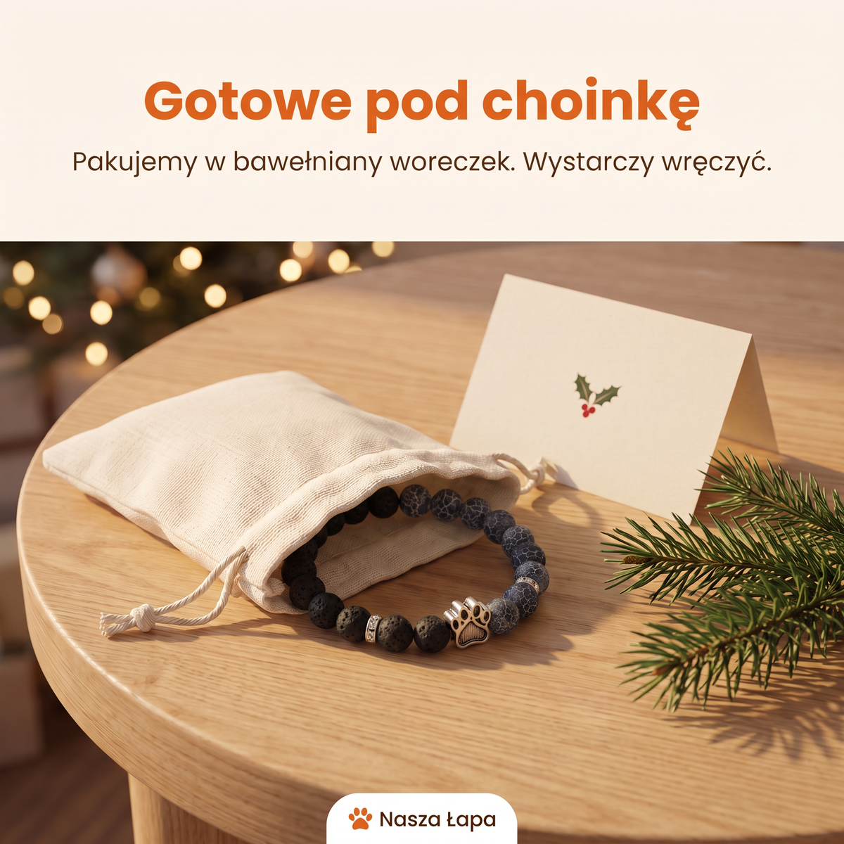 Bransoletka Burzowa Chmura w bawełnianym woreczku obok świątecznej kartki, gotowe pod choinkę
