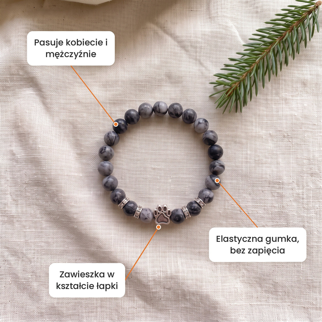 Cechy: Bransoletka Polny Kamień. Zawieszka w kształcie łapki, elastyczna gumka bez zapięcia, pasuje kobiecie i mężczyźnie