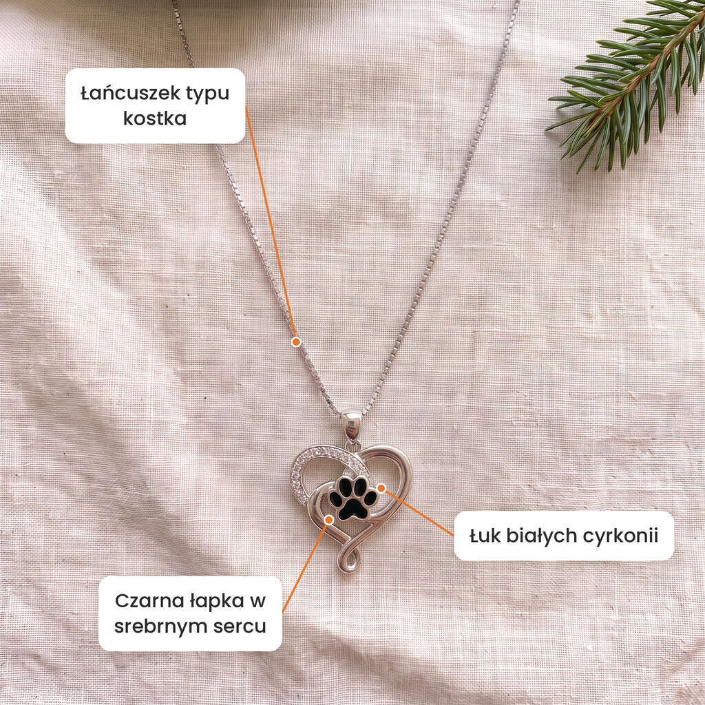 Cechy: Naszyjnik Tęczowy Most. Czarna łapka w srebrnym sercu, łuk białych cyrkonii, łańcuszek typu kostka